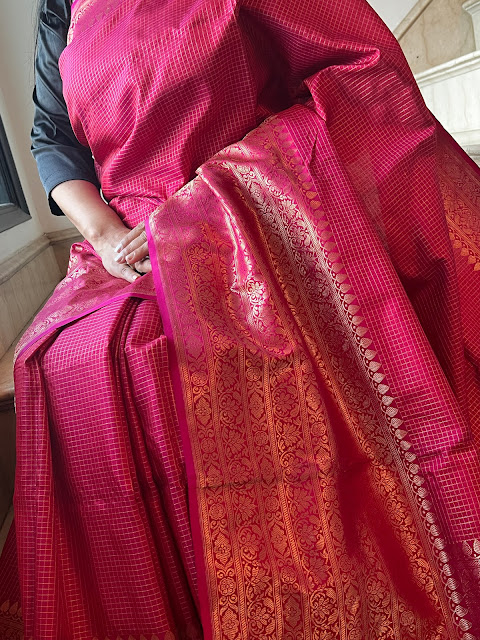 Radiant Elegance: Exploring the Pink Checkered Silk Kanjivaram Saree with a Broad Skirt Border