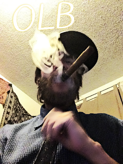 Oregonleatherboy from chest up superior POV smoking cigar thick smoke