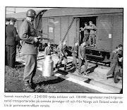 . a Swedish soldier stands guard over a German troop train while German . (tysktagen)