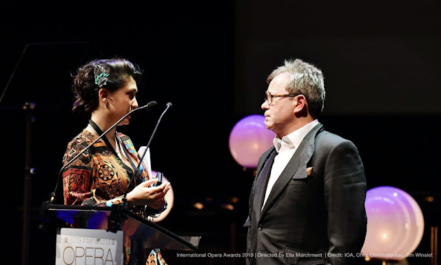 Ella Marchment at the 2019 International Opera Awards, which she directed, with James Clutton, director of Opera Holland Park