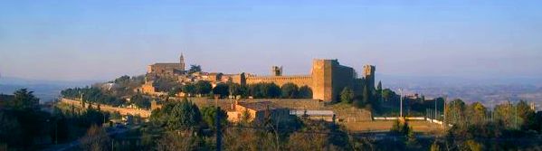 View of Montalcino's fortress and town wall at sunset