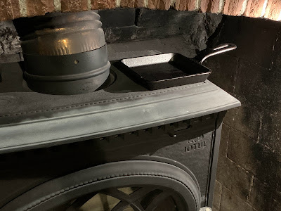 cast iron pan on wood stove