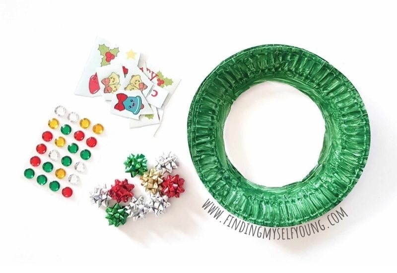 craft supplies to make a paper plate Christmas wreath.