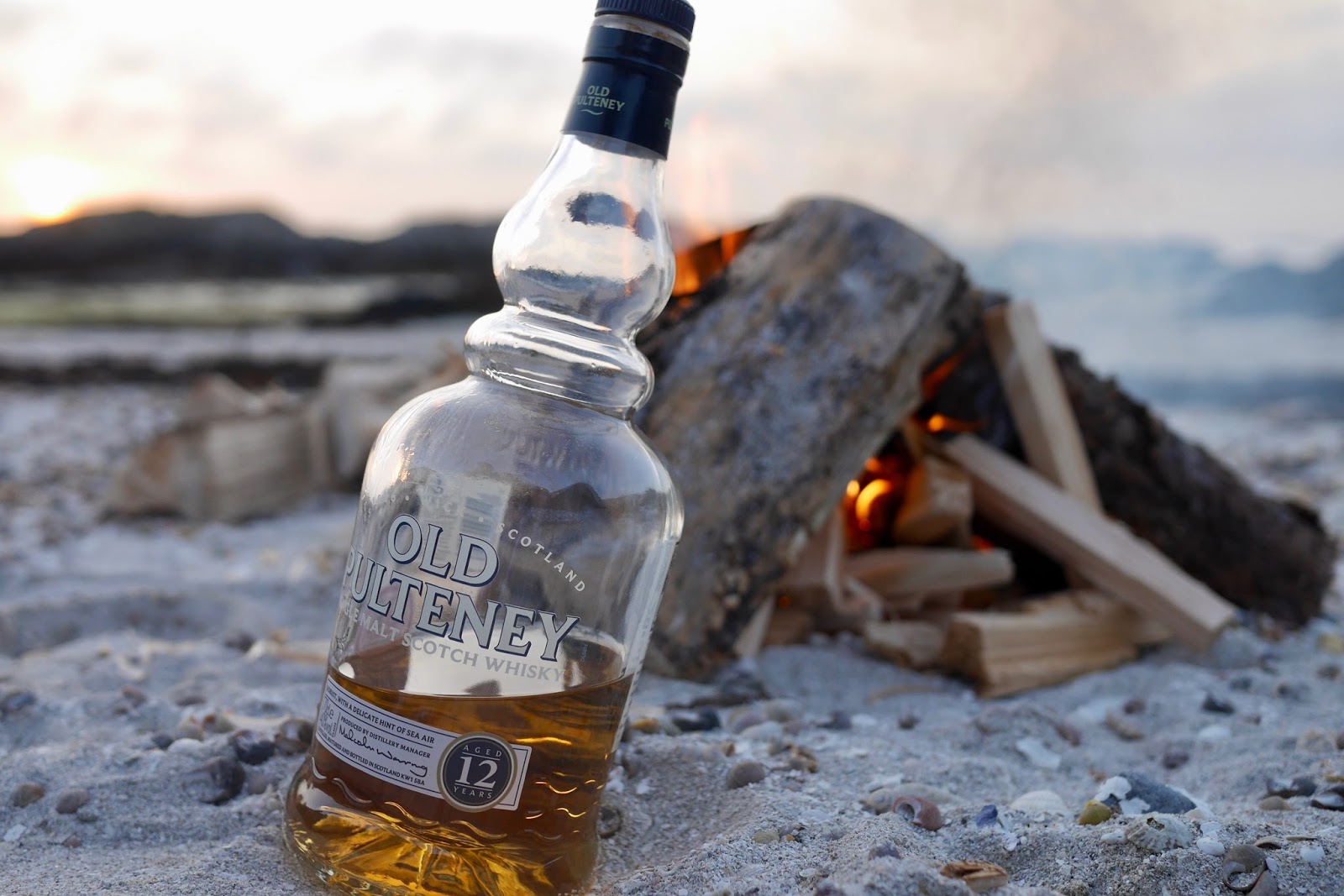 A bottle of old pulteney sitting by the camp fire just itching to be drunk