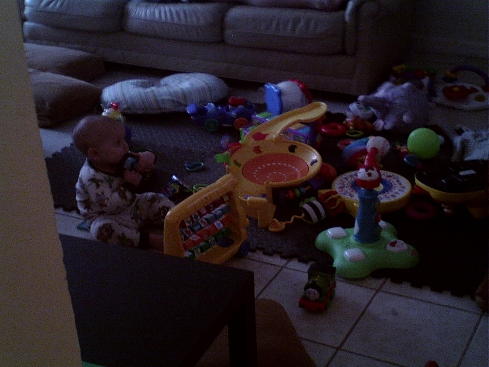Wordless Wednesday picture of our baby playing with toys, beautiful baby mess poem
