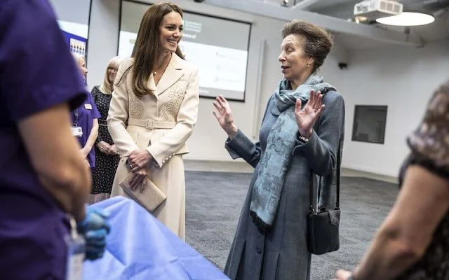 Kate Middleton wore a new lace detail crepe belted midi dress by Self Portrait. Annoushka drop earrings