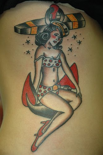 anchor tattoo. Girl on anchor tattoo.