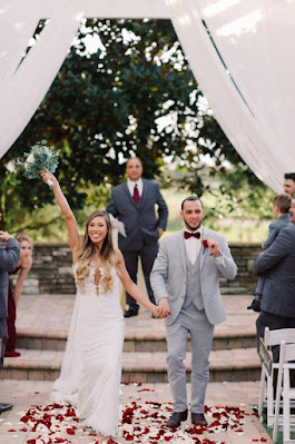 happy bride and groom leaving ceremony