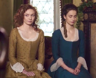 Demelza Poldark as Ross Poldark's new wife sits next to Elizabeth to be compared by Aunt Agatha