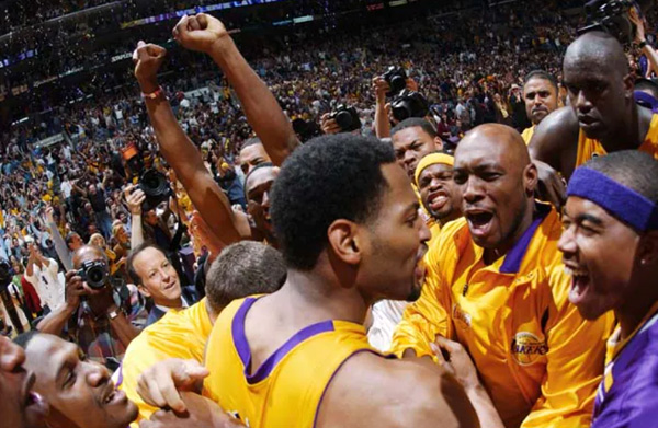 The Los Angeles Lakers celebrate after Robert Horry hit a clutch 3-pointer to help the team win Game 4 of the NBA Western Conference Finals, 100-99, on May 26, 2002.