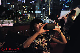 Framing a shot on the roof top bar in Singapore.  Photo by Kent Johnson for Street Fashion Sydney.