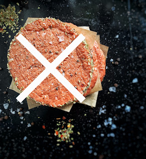 A meat patty with an X over it.