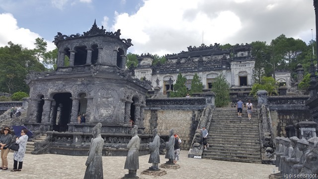 Tomb of Khai Dinh. The Stele Pavllion stands in the middle of the forecourt, with two rows of stone elephant, horse and mandarins and a tall obelisk on each side.  