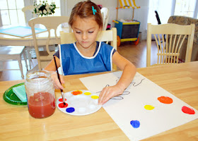 Tessa carefully mixed yellow with red to make orange, blue with red to make violet, and yellow with blue to make green.
