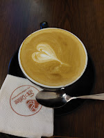 Mahmudul Munna enjoying coffee in a coffee shop at Nayasarak, Sylhet