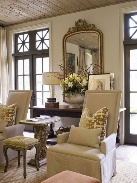 love thewood windows in this neutral cream traditional living room