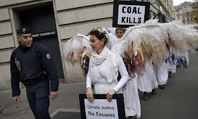 Climate Change Demonstrators dressed as Angels with Coal Kills Signs
