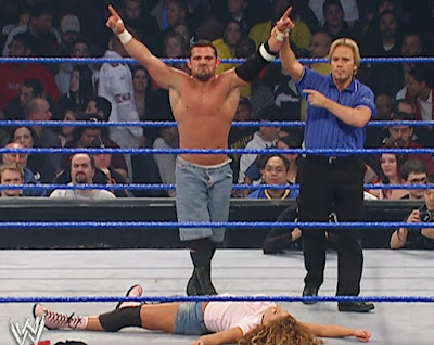 WWE No Way Out 2004 - Jamie Noble stands triumphant over Nidia