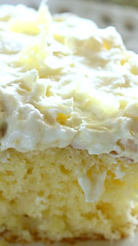 A light and fluffy pineapple-infused cake, topped with a sweet and creamy whipped cream frosting