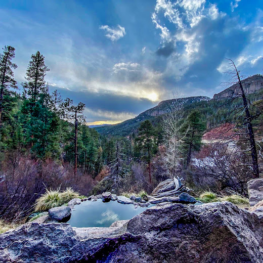 View of mountains and sky from a natural hot spring. Photo by Leslie Driskill