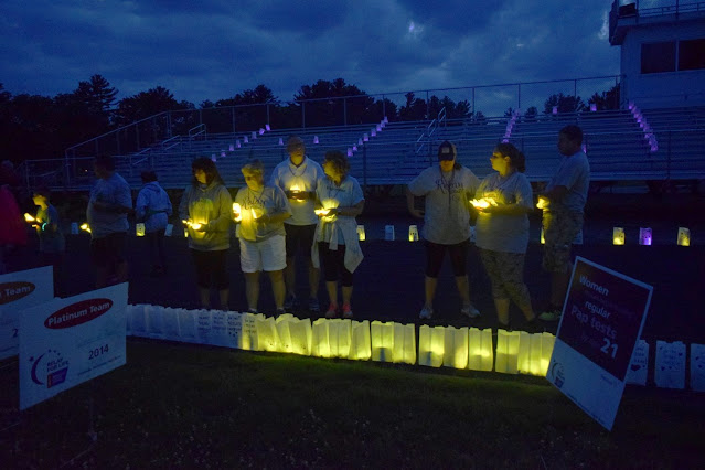 Luminaria light up the track at a past relay.