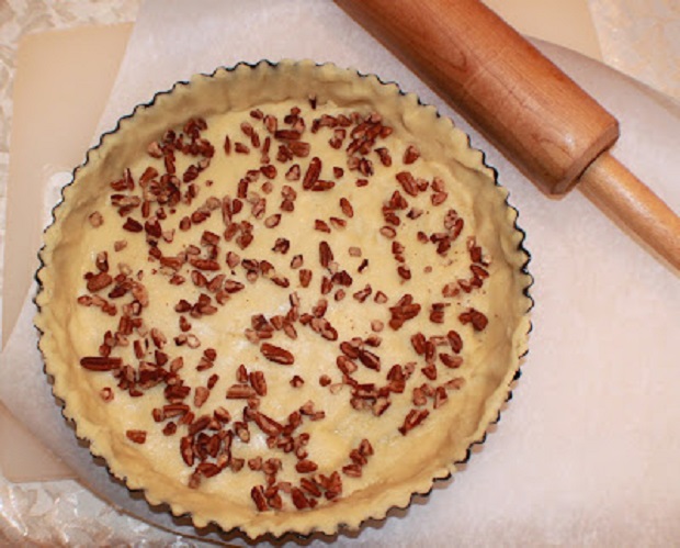 nuts on a pastry crust before baking