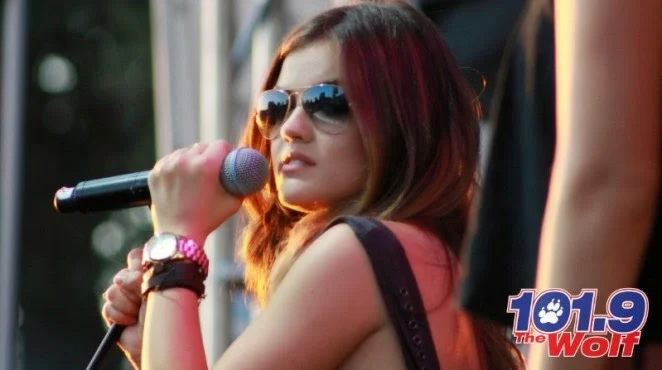 Lucy Hale performs in a plaid skirt at the 2014 Wolf Fest in Sacramento