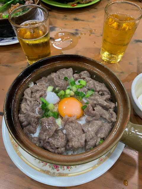 Beef claypot rice with raw egg and spring onions