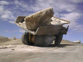 big rock in giant dump truck