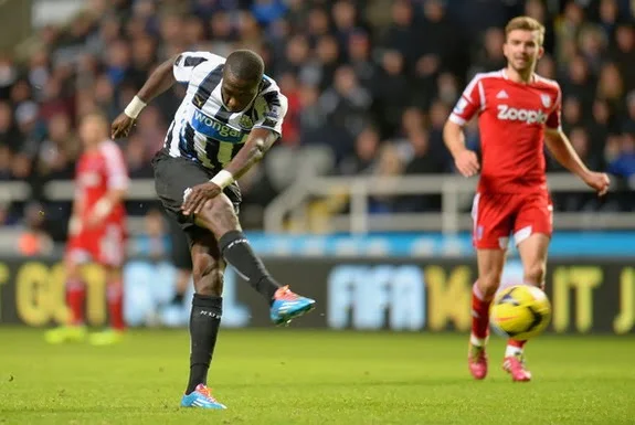 Newcastle player Moussa Sissoko shoots to score his team's winning goal against West Brom