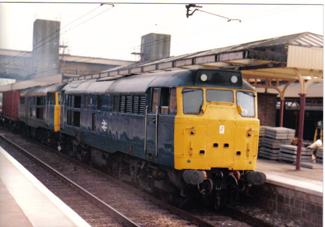 a photo of two br blue class 31 diesel locomotives double heading at bletchley