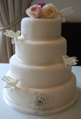 Four Tier White Vintage Wedding Cake Decorated With Sugar LoveBirds And 