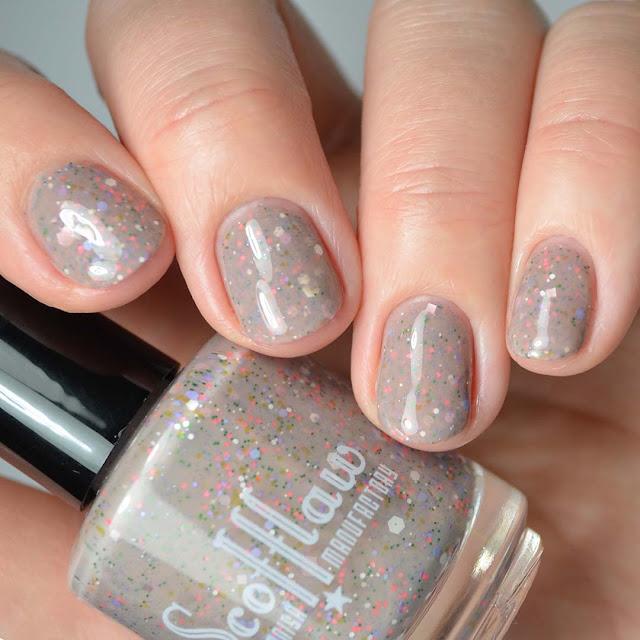 nude nail polish with 60's inspired glitter mix swatch