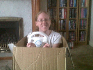 Cardboard box being used as a car