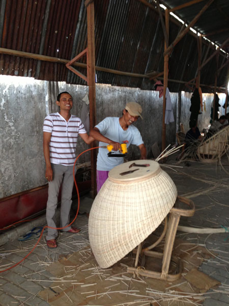 The Indonesian workers finishing off the Rattan Swivel Chair 