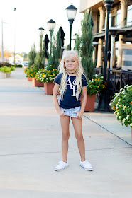 little girl outfit idea casual white sneakers abercrombie hairstyle braids pigtail buns