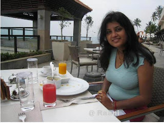 Hot teenage girl dining at beach restaurant.