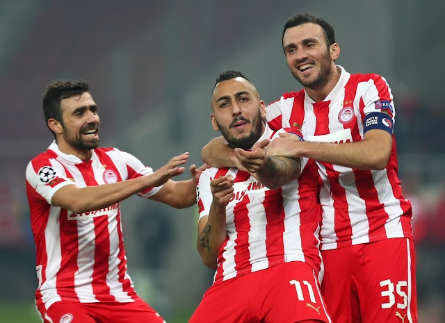 Kostas Mitroglou celebrates his goal on the 73rd minute with Giannis Maniatis and Vassilis Torossidis.