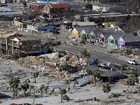 The devastation from Hurricane Michael over Mexico Beach, Fla. A massive federal report released in November warns that climate change is fueling extreme weather disasters like hurricanes and wildfires. (Credit: Gerald Herbert/AP) Click to Enlarge.