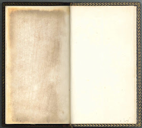 An open book. Both visible pages are blank.