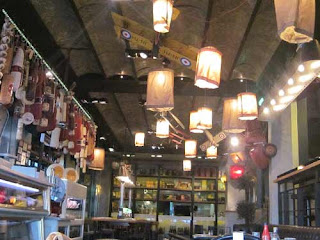 Lanterns And Deli Meats Hang In Agioli Restaurant.