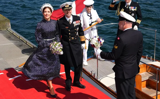 Queen Mary wore an Alison navy polka dot satin midi dress by Iris & Ink, and blue leather pumps by Gianvito Rossi