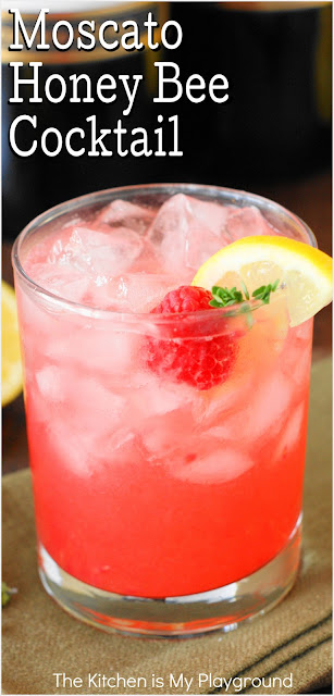 Moscato Honey Bee Cocktail ~ Grab a jar of honey & some fresh raspberries to whip up this delicious wine cocktail! It's just perfect for Easter brunch, Mother's Day lunch, a bridal shower, or everyday sipping.  www.thekitchenismyplayground.com