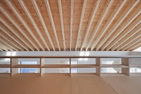 Contemporary House Style With Exposed Timber Rafter And Bookshelf Column