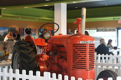 Big red tractor at the front door of P&H.