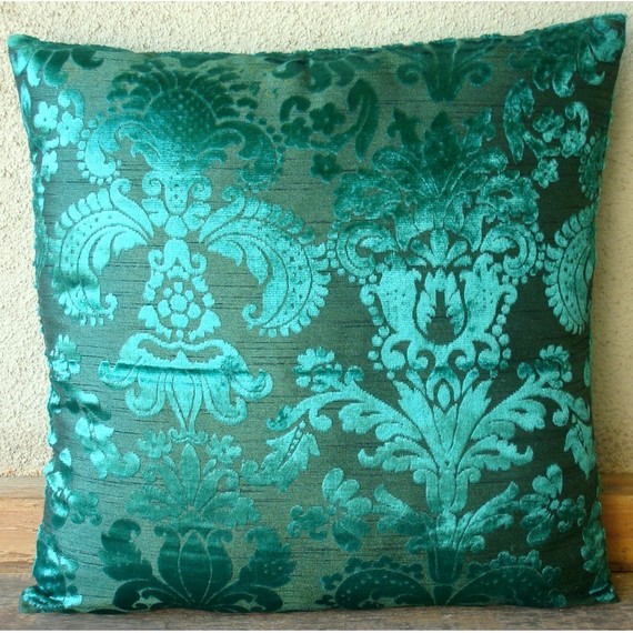 This Terra Cottacolored pillow is a beautiful color and the flower detail 