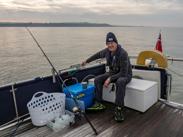 Photo of Phil waiting for a fish to bite