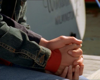 Close up of Pacey and Joey's hands joined together