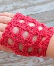 http://www.ravelry.com/patterns/library/rockin-fingerless-mitts