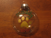 . and personalization includes your pet's name, a paw print, and the year. (maddy paw print)